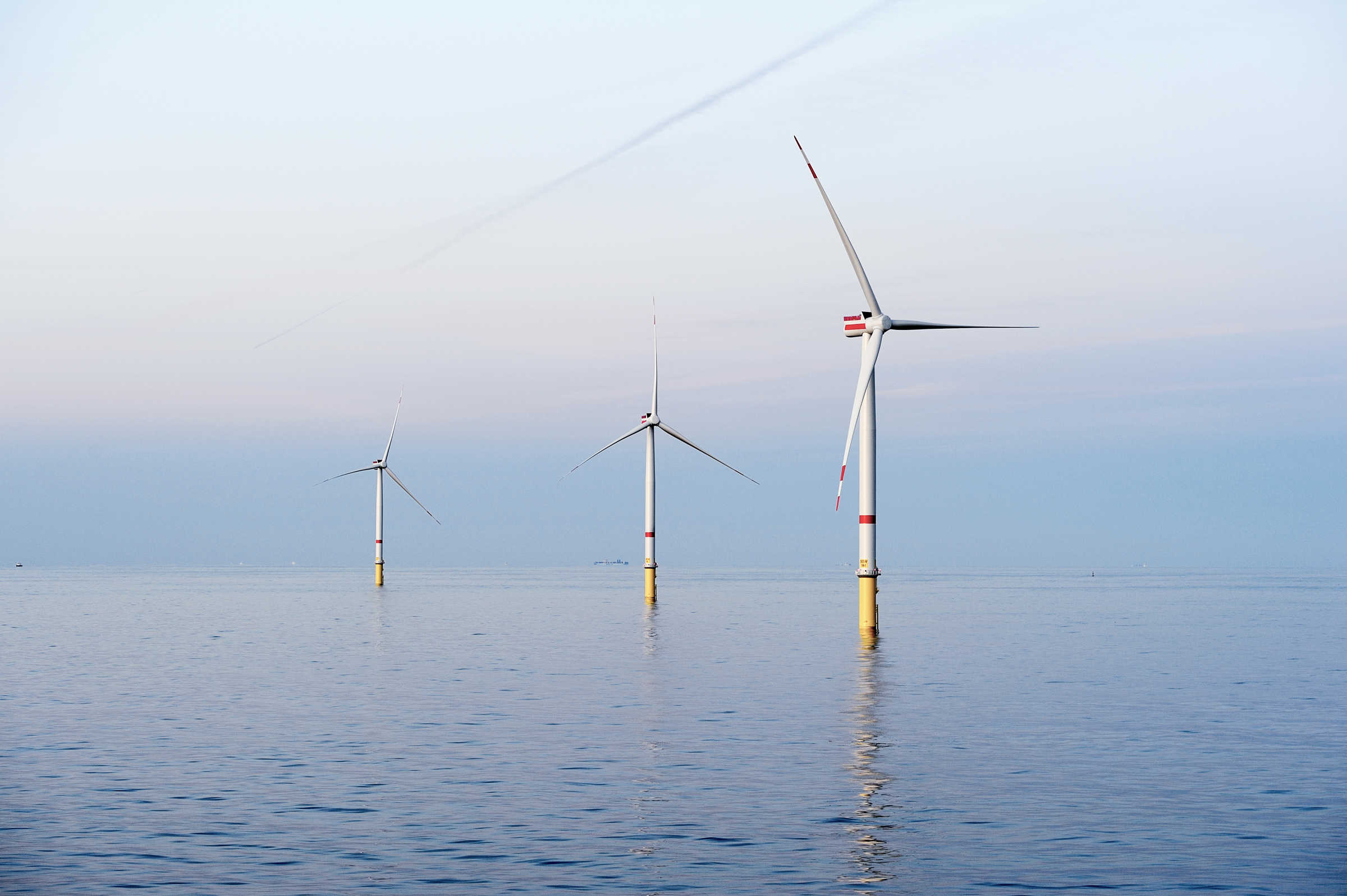 Gode wind farm off the coast of Germany showing three turbines in the sea