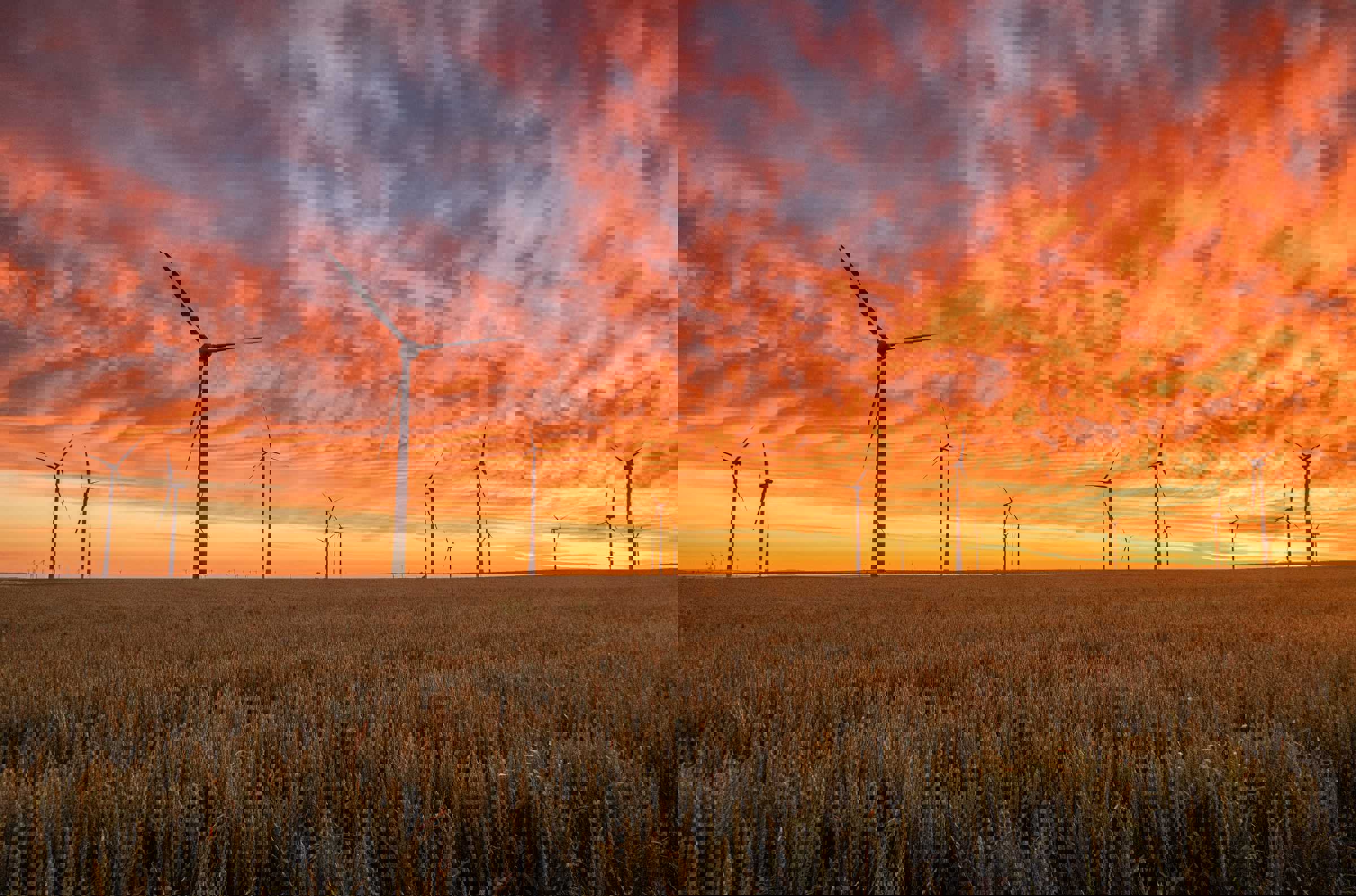 Wind turbines against the sunset